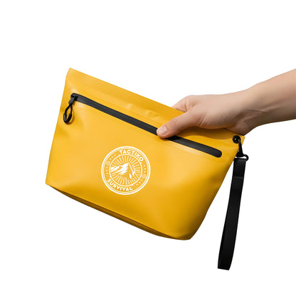 Hand holding yellow waterproof pouch